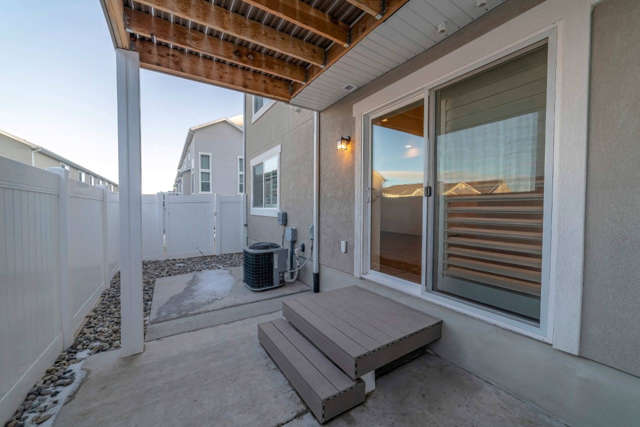 An exterior view of a sliding glass door with an interior shutter at The Decorated Wall near Dallas, OR